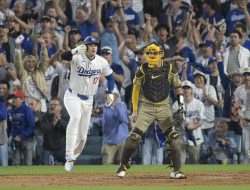 Shohei Ohtani leads Dodgers past Padres in playoff debut